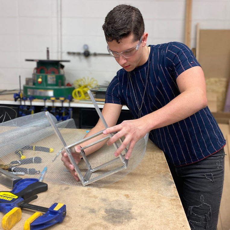 Student designing mesh basket